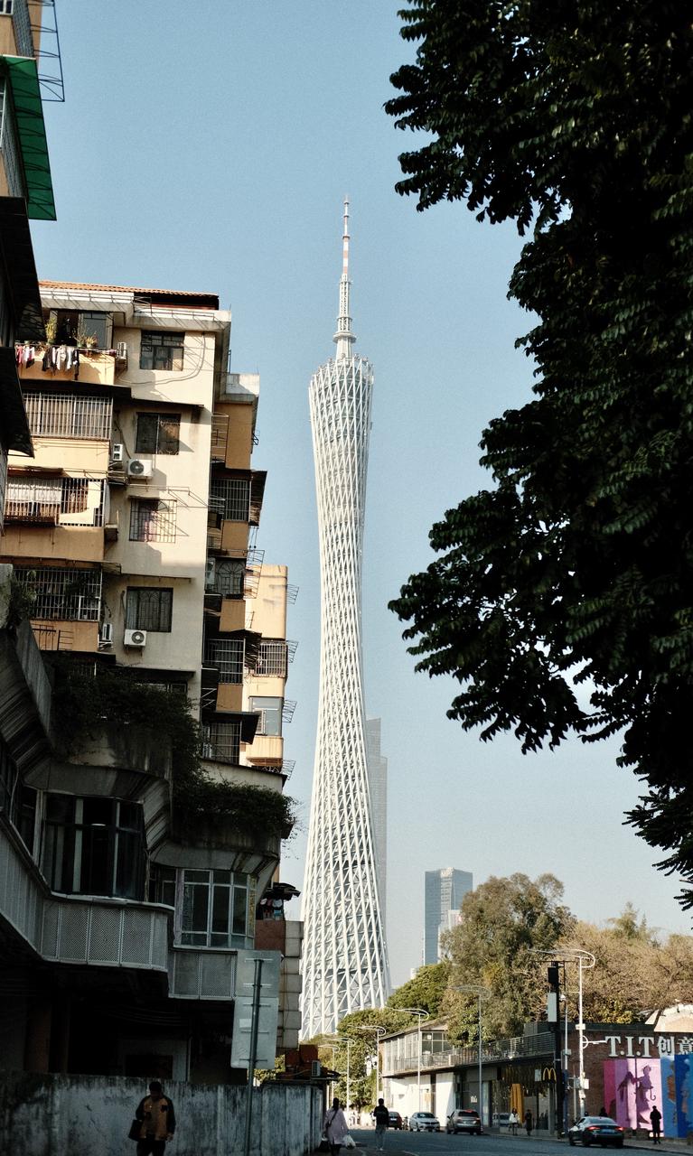 Canton Tower glowing above the Pearl River at dusk in Guangzhou